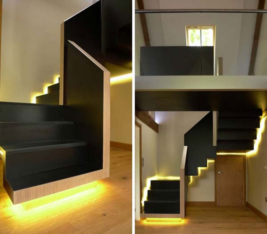 STAIRS--stunning-floating-black-colored-wood-staircase-with-endearing-yellow-lighting-effect-ins.jpg